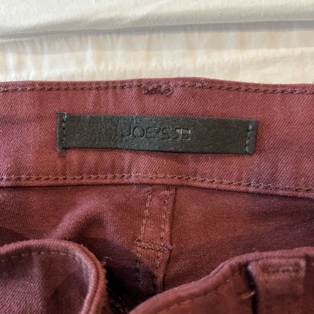 Joe’s jeans - women’s size 27 Maroon color length is short- straight leg flair